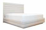 A Channel Bed, King by EJ Schrader with a tall, horizontal panel headboard and a white Pure by Hive mattress on top.