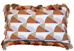 The Manille Cuba Lumbar Pillow with Tassel Fringe by Hive Custom Pillows features a 14" x 22" geometric design in brown, tan, and pink with multi-colored tassels, inspired by the Kips Bay Show House.