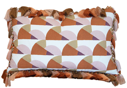 The Manille Cuba Lumbar Pillow with Tassel Fringe by Hive Custom Pillows features a 14" x 22" geometric design in brown, tan, and pink with multi-colored tassels, inspired by the Kips Bay Show House.