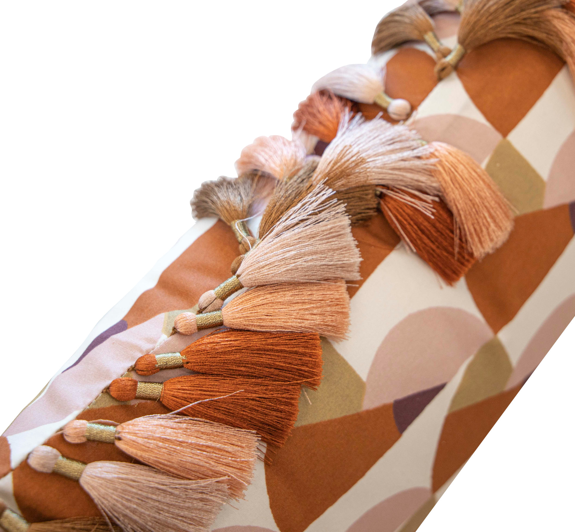 A close-up of the Manille Cuba Lumbar Pillow with Tassel Fringe by Hive Custom Pillows, a 14" x 22" down-filled pillow featuring muted geometric patterns and pink, orange, and beige tassels inspired by Kips Bay Show House style.