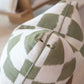 Close-up of the Checkerboard Green Pillow by Hive Custom Pillows, 22" x 22", featuring a green and white geometric checker pattern, textured fabric, and highlighted edge seam.