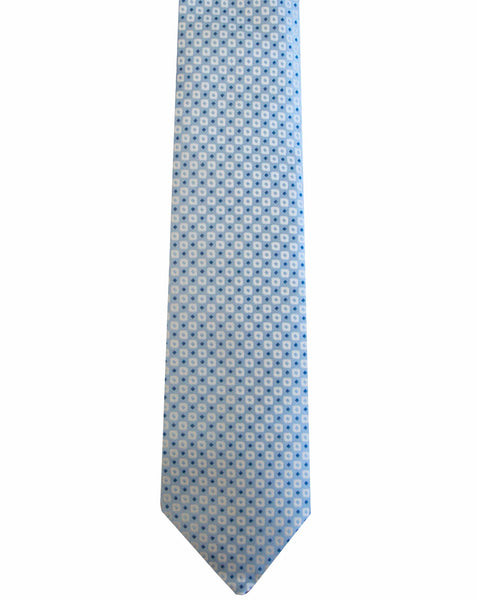 A light blue, handcrafted Robert Jensen Square Dot Tie, Blue featuring a small, repeating white square pattern, reminiscent of the meticulous work of traditional artisans from California's Central Coast.