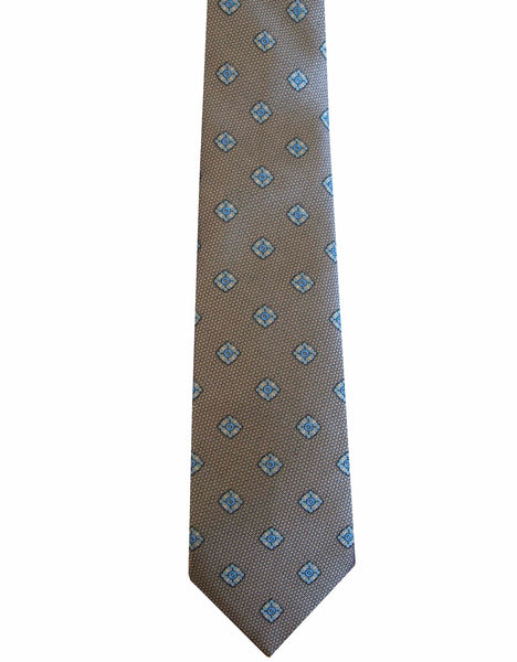 A Robert Jensen Large Diamond Pattern Tie by Robert Jensen, adorned with a repeating pattern of blue diamond shapes, showcasing the artistic expression of traditional artisans.