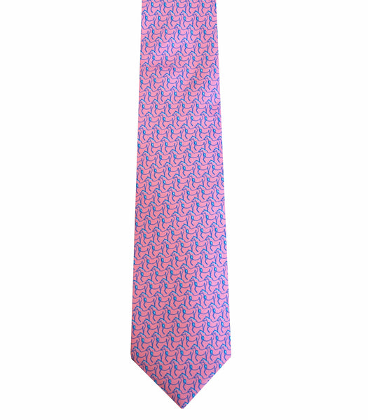 A Robert Jensen Equestrian Tie, Pink and Blue, handcrafted by traditional artisans, showcases a pattern of blue interlocking designs that accentuate your personal style.