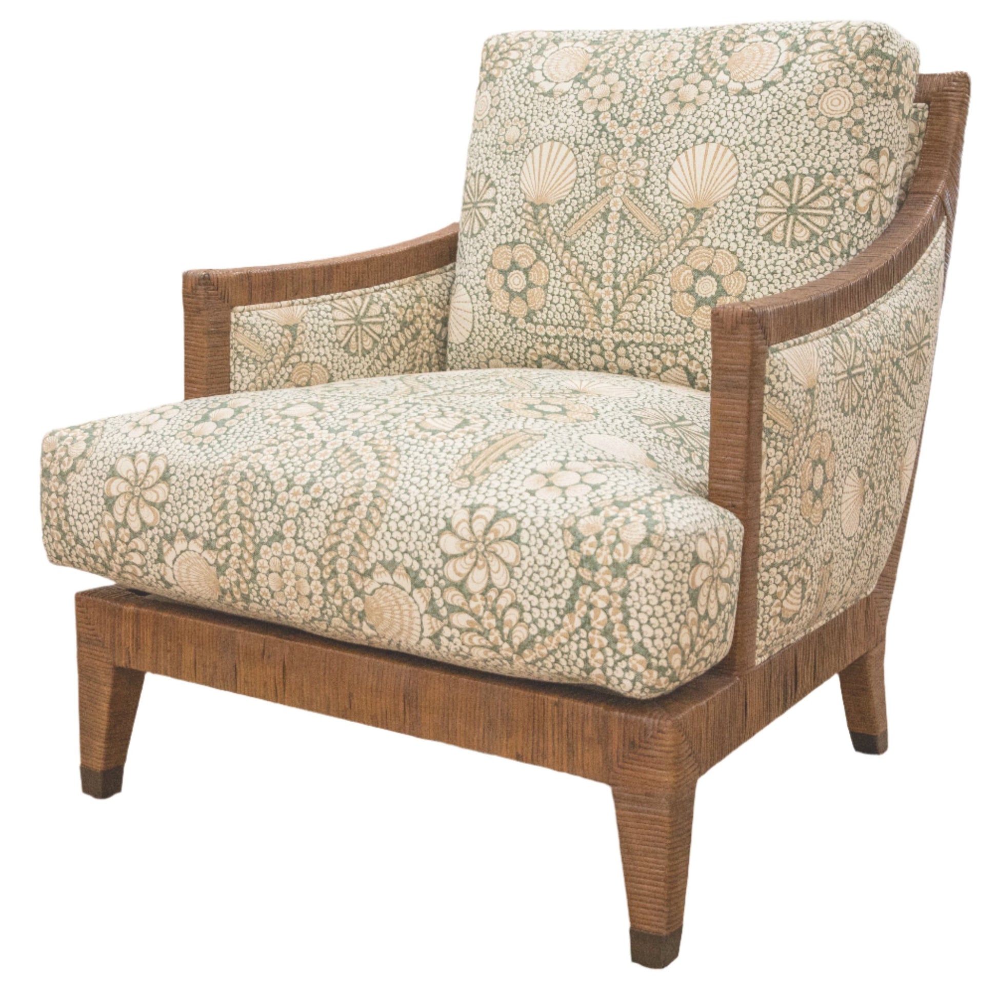 Inspired by 1940s French design, the St. Germain Lounge Chair by McGuire Furniture features a wooden frame and legs with light green and cream floral upholstery for a luxurious touch.