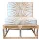The Sea Cliff Slipper Chair, Palmetto Stripe by Selamat features a cushioned seat and backrest, upholstered in a white fabric with a brown palm leaf pattern.
