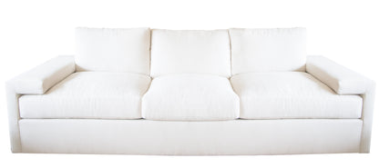 The Denby Sofa by Hickory Chair, featuring a white, three-cushion design with wide armrests, plush back cushions, and a Spring-Down seat cushion, exemplifies European luxury fashion against a plain background.