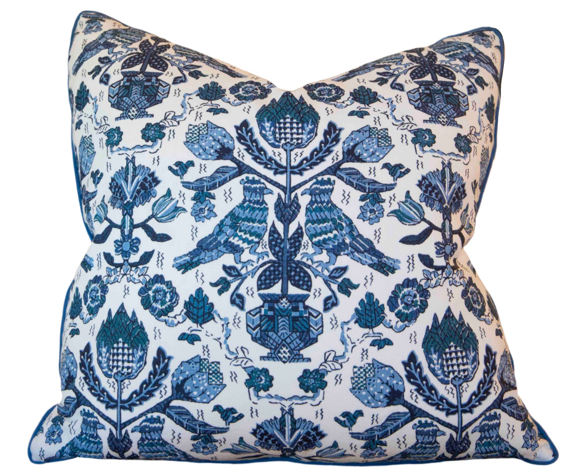 Handmade in the USA, the Damour Blues Pillow by Hive Custom Pillows features a square shape, white background, and an intricate blue pattern of birds, flowers, and leaves arranged symmetrically.
