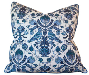 Handmade in the USA, the Damour Blues Pillow by Hive Custom Pillows features a square shape, white background, and an intricate blue pattern of birds, flowers, and leaves arranged symmetrically.