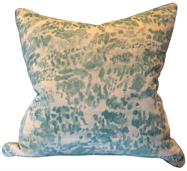 The Heather Moss Pillow by Beleo Interiors LLC is a handmade, square, down-filled pillow featuring a green and white abstract pattern. Crafted in the USA, it offers both comfort and style.