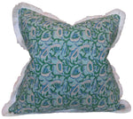 The Marbella Linen Emerald Pillow by Hive Custom Pillows features a blue and green floral pattern with white fringe trim for a charming finishing touch.