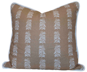 The Petite Frond Camel Pillow by Hive Custom Pillows features a tan background with white vertical leaf patterns and light blue trim. Handmade in the USA, this unique accent adds style to your home décor.