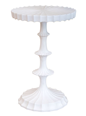 The Priscilla Side Table by Oly features a white, sculpted fluted base and a wavy scalloped tabletop edge, offering understated luxury as a sophisticated focal point for any room.