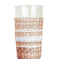 The Be Home Seagrass White Stripe Glassware Collection features a clear tumbler with stylish seagrass wrapping and two white horizontal stripes, shown here against a white background.