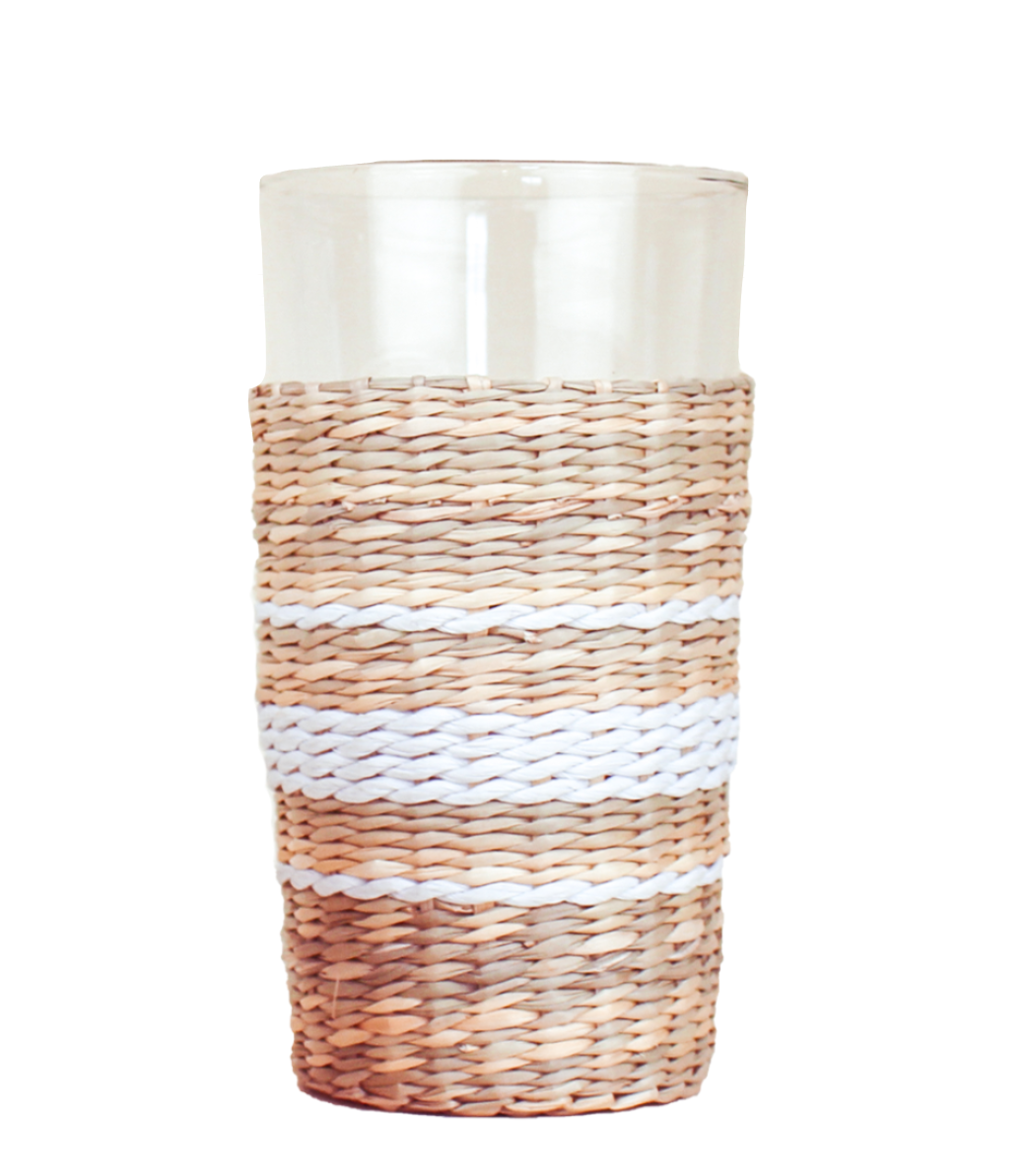 The Be Home Seagrass White Stripe Glassware Collection features a clear tumbler with stylish seagrass wrapping and two white horizontal stripes, shown here against a white background.