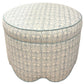 The Suzie Scalloped Ottoman by Highland House showcases blue and beige patterned upholstery and scalloped edges, making it a chic and versatile piece for extra seating or use as a footrest in any room.