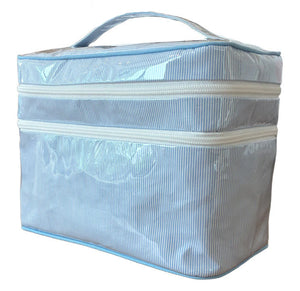 The Walker Valentine Walton Travel Case features a handle, cheerful blue and white stripes, and two white zippers.