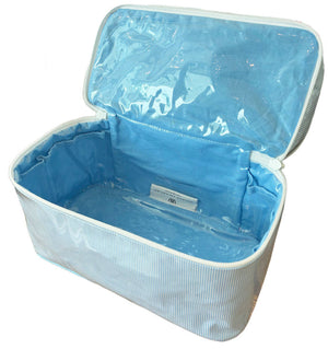 The Walker Valentine Walton Travel Case is a light blue, rectangular case with a zippered lid and smooth, waterproof lining—ideal for keeping essentials organized while traveling.