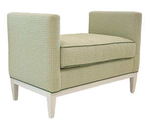 The Lee Ottoman by Lee Industries features high, padded arms, a thick seat cushion in a green geometric print, and light wood legs—ideal for extra seating in any room.