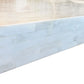 Close-up of a corner edge featuring rectangular, light stone tiles in a staggered layout, evoking the refined artistry of Bojay’s Bone Inlay Cocktail Table and adding stylish flair to any modern living room.