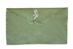 From the Pink House Mustique Linen Envelope Pouch Collection, this green pouch features a scalloped flap, button closure, and delicate white floral embroidery near the top center for a touch of coastal charm.