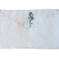 The Linen Envelope Pouch Collection by Pink House Mustique features a white linen pouch with a scalloped flap, button closure, and green embroidery—an elegant way to bring coastal charm to your essentials.