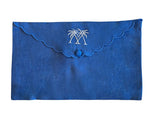 The Pink House Mustique Linen Envelope Pouch Collection features blue linen pouches with scalloped edges, button closure, and two white palm tree embroideries for a coastal touch.