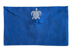 Part of the Linen Envelope Pouch Collection by Pink House Mustique, this blue linen pouch features coastal charm with scalloped edges, a button closure, and a white embroidered turtle on the flap.