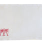 The Pink House Mustique Coastal Linen Placemat Set features rectangular white placemats with two pink embroidered palm trees in the lower left corner, bringing a beach-inspired accent to your dining space.