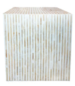 The Bojay Stripe Side Table is a large cube with vertical beige and off-white stripes, highlighting artisanal craftsmanship, shown against a white background.