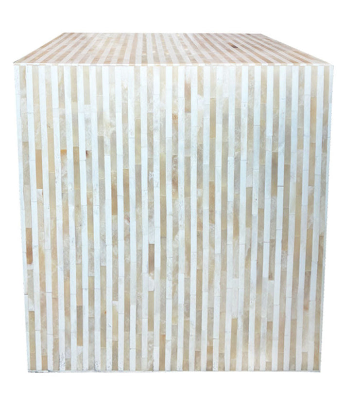 The Bojay Stripe Side Table is a large cube with vertical beige and off-white stripes, highlighting artisanal craftsmanship, shown against a white background.
