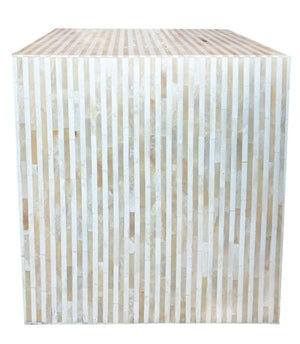 The Bojay Stripe Side Table is a large cube with vertical beige and off-white stripes, highlighting artisanal craftsmanship, shown against a white background.