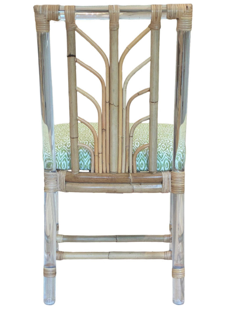 The Sea Cliff Side Chair, Amala Vert by Associated Design features an acrylic and bamboo frame with a custom green Amala Ikat seat cushion, shown from the back.