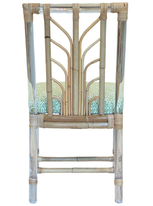 The Sea Cliff Side Chair, Amala Vert by Associated Design features an acrylic and bamboo frame with a custom green Amala Ikat seat cushion, shown from the back.