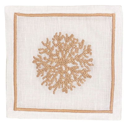The Sea Sponge Coaster Set by Haute Home features white linen coasters with a central beige hand-embroidered coral motif and a delicate light brown border.