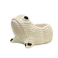 From the Ceramic Frog Collection by Jean Roger Paris, this white ceramic frog planter features a textured surface, black eye and toe details, and a back opening for displaying a small plant.