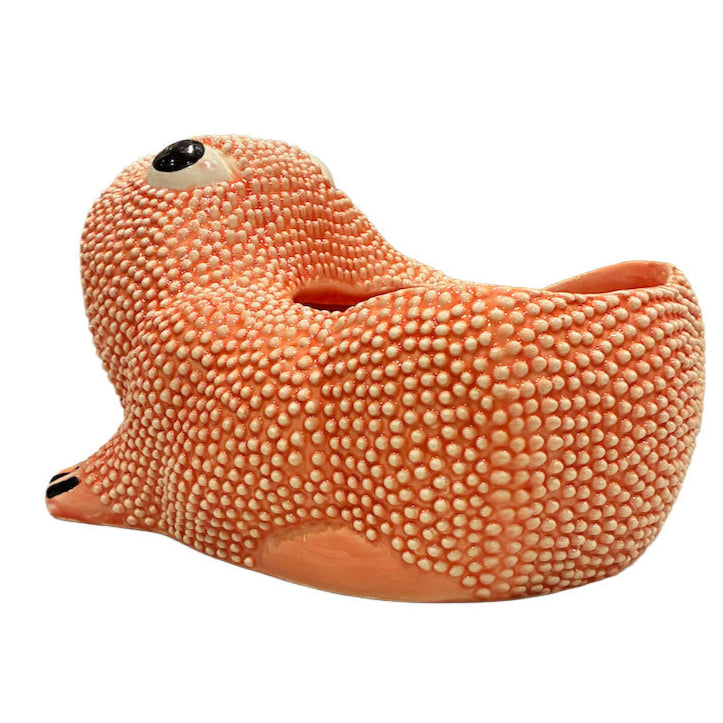 Part of the Jean Roger Paris Ceramic Frog Collection, this whimsical planter features playful textures and a unique animal shape, capturing the charm of Jean Roger’s iconic designs with an opening on its back for plants.