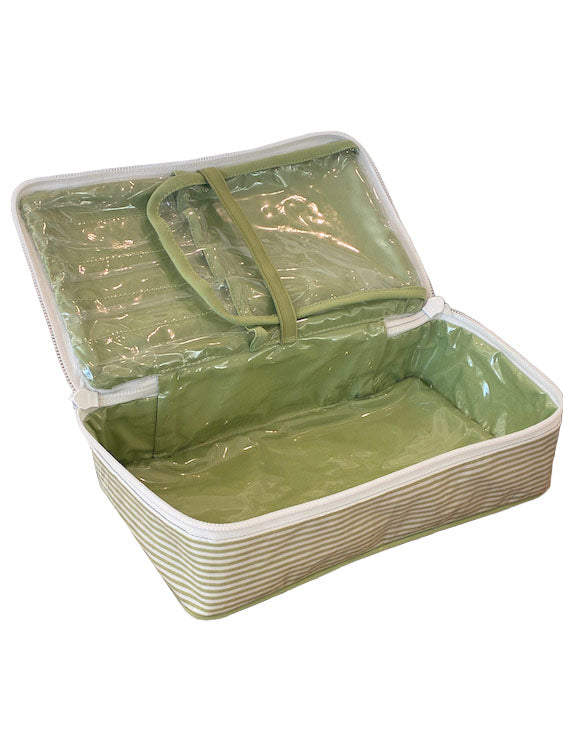 The Walker Valentine Handled Brush and Makeup Case is a rectangular green striped makeup bag with a zippered closure, transparent plastic lining, brush compartments, and an open lid, shown empty.