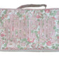 The Walker Valentine Handled Brush and Makeup Case is a rectangular bag with a floral pink, green, and white pattern and "MAKE UP" on the front—ideal as a travel case for organizing brushes and essentials.