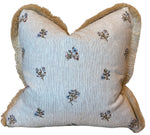 The Flax Field Pinstripe Brush Fringe Pillow by Hive Custom Pillows features thin gray stripes, small blue floral accents, and beige fringe trim—crafted from premium materials for elegant custom style.