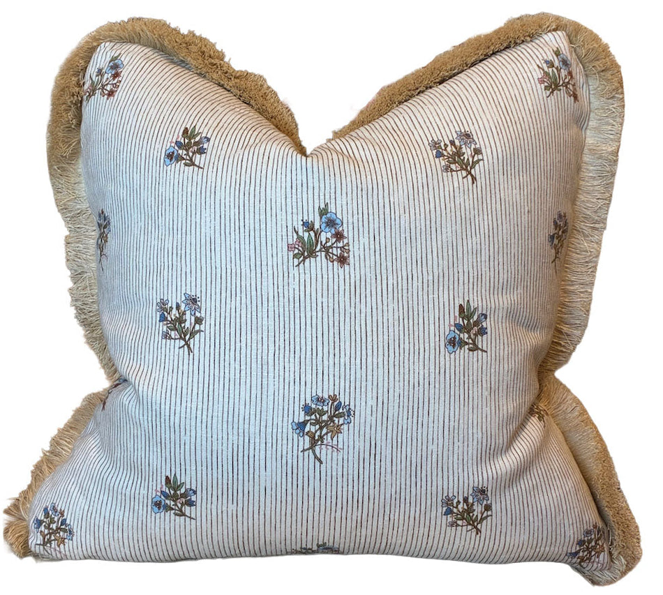 The Flax Field Pinstripe Brush Fringe Pillow by Hive Custom Pillows features thin gray stripes, small blue floral accents, and beige fringe trim—crafted from premium materials for elegant custom style.
