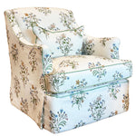 The Bowen Arm Chair in Flax & Field Flowers by Bunny Williams features elegant slipcover upholstery, a skirted base, subtle floral print, and comes with a matching cushion for added charm.