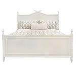 The Bambu King Bed by Sherrill/Mr & Mrs Howard features turned posts and a decorative headboard, creating timeless style. Shown here dressed with floral bedding and three pillows for an inviting bedroom look.