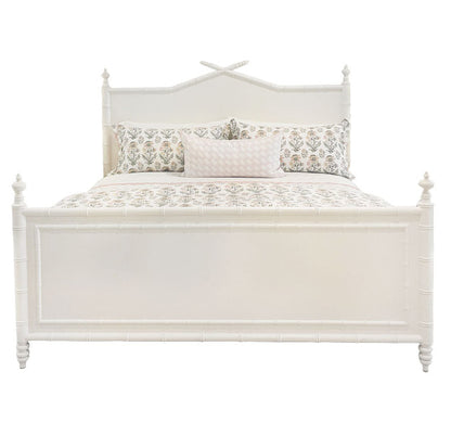 The Bambu King Bed by Sherrill/Mr & Mrs Howard features turned posts and a decorative headboard, creating timeless style. Shown here dressed with floral bedding and three pillows for an inviting bedroom look.