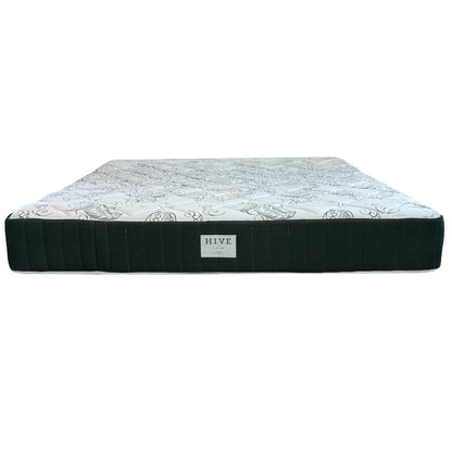The EJ Schrader Hive Custom Palm Mattress offers firm support with a white cover and cooling gel foam for enhanced comfort and temperature regulation.