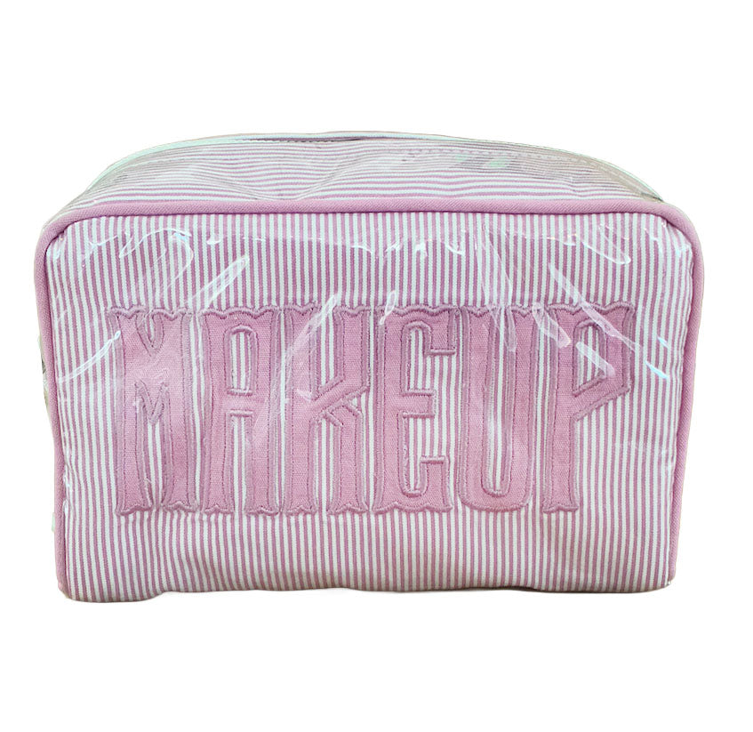 The Walker Valentine Small Milan Cosmetic Case features pink and white stripes with bold, raised "MAKEUP" lettering—a stylish, travel-friendly organizer for all your beauty essentials.