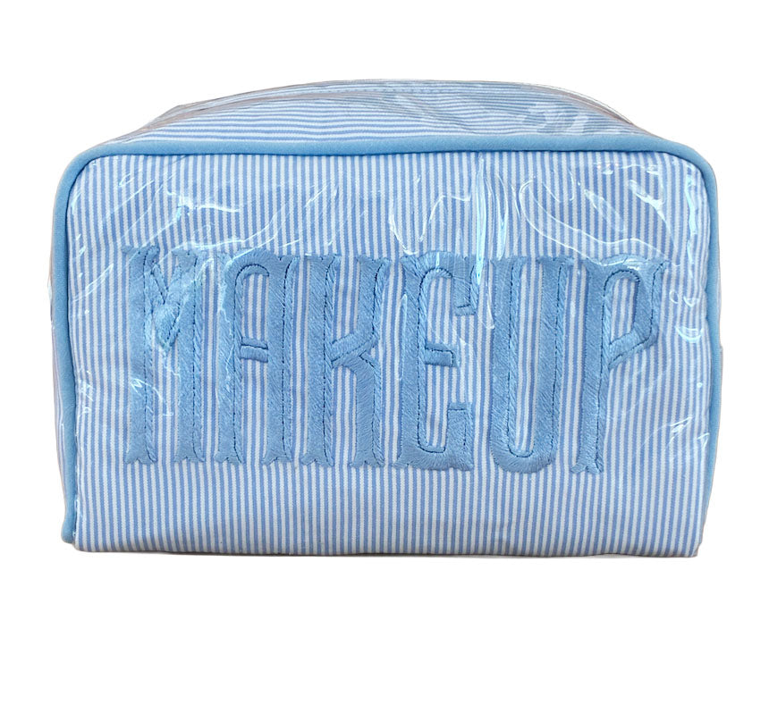 The Walker Valentine Small Milan Cosmetic Case features blue and white stripes and "MAKEUP" embroidered on the front—ideal for organizing your beauty essentials while traveling.