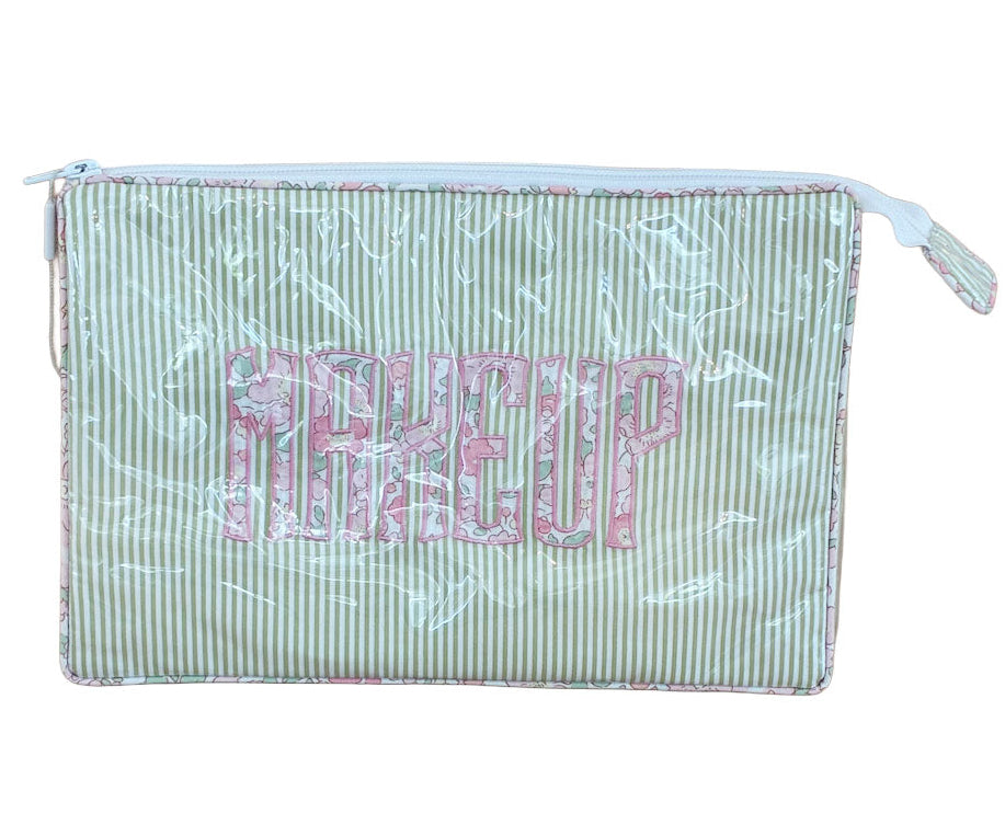The Walker Valentine Large Helen Cosmetic Case, "MAKEUP", features green and white stripes with "MAKEUP" in bold pink letters—an ideal zippered pouch to organize your beauty essentials.