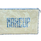 The Walker Valentine Large Helen Cosmetic Case features a rectangular shape, zipper closure, vertical stripes, and "MAKEUP" in blue patterned letters on the front—perfect for organizing your beauty essentials.