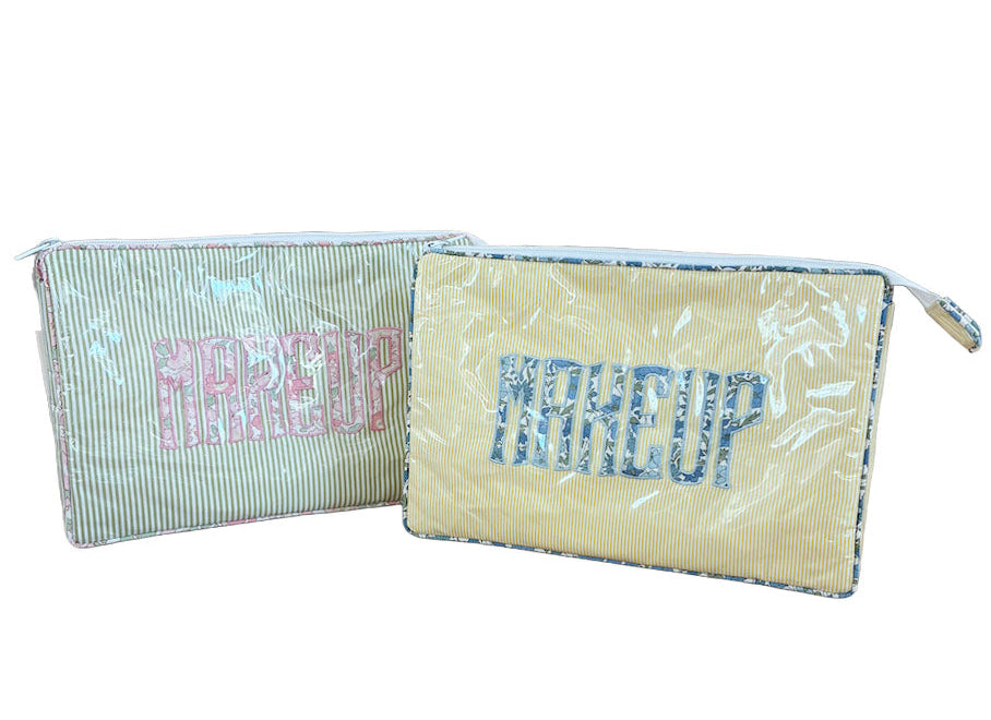 The Walker Valentine Large Helen Cosmetic Case features a rectangular travel bag with striped patterns, “MAKEUP” printed on the front, and a zipper closure—ideal for stylish, on-the-go beauty storage.